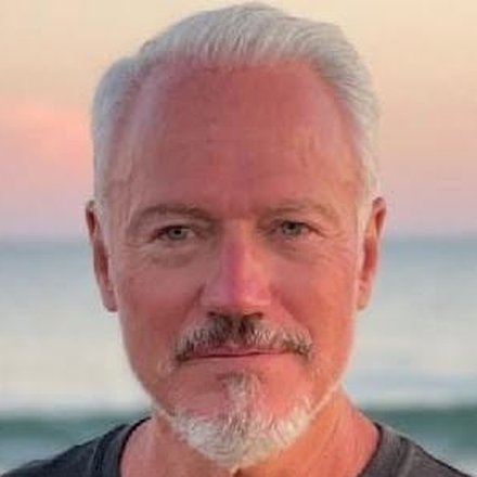 Robin T. Baker on the beach at sunset